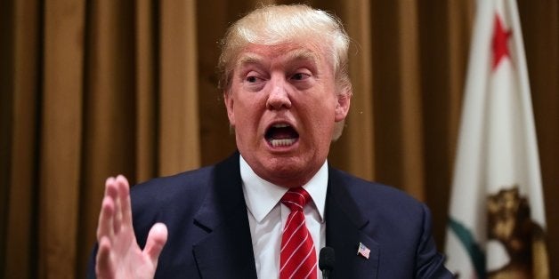 Donald Trump gestures at a press briefing where he introduced people whose families were victims of illegal immigrants on July 10, 2015 at the Beverly Wilshire Hotel in Beverly Hills, California, where some shared their stories of the loss of a loved one. The US business magnate Trump, who is running for President in the 2016 presidential elections, angered members of the Latino community with recent comments but says he will win the Latino vote. AFP PHOTO / FREDERIC J. BROWN (Photo credit should read FREDERIC J. BROWN/AFP/Getty Images)