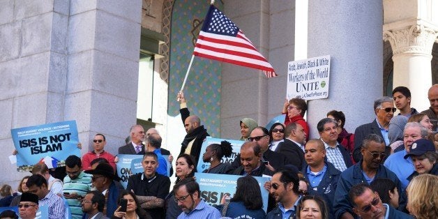LOS ANGELES, UNITED STATES - DECEMBER 13: Hundreds of Californians, mostly including Muslims, gather to stage a protest against terrorism and violence, staged with the attendance of Los Angeles Mayor Eric Garcetti (not seen), San Bernardino Mayor Carey Davis (not seen) and Chief of the Los Angeles Police Department Charlie Beck (not seen) with some prominent Muslims of the society, in front of the Los Angeles City Hall on December 13, 2015 in Los Angeles, CA, USA. (Photo by Mintaha Neslihan Eroglu/Anadolu Agency/Getty Images)