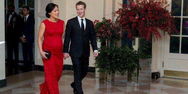 Mark Zuckerberg, chief executive officer and founder of Facebook Inc., right, and his wife Priscilla Chan arrive at a state dinner in honor of Chinese President Xi Jinping at the White House in Washington, D.C., U.S., on Friday, Sept. 25, 2015. The U.S. and China announced agreement on broad anti-hacking principles aimed at stopping the theft of corporate trade secrets though President Barack Obama pointedly said he has not ruled out invoking sanctions for violators. Photographer: Andrew Harrer/Bloomberg via Getty Images 