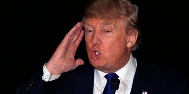 Republican presidential candidate, Donald Trump gestures as he addresses a gathering at a regional police union meeting in Portsmouth, N.H., Thursday, Dec. 10, 2015. (AP Photo/Charles Krupa)