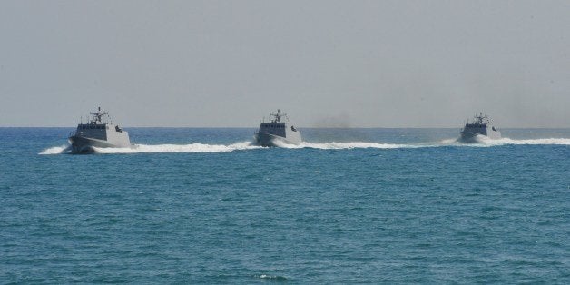 Three Taiwanese-built missile boats take part in an exercise in waters off the southern naval base of Tsoying on July 21, 201