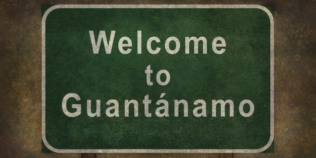 Welcome to Guantanamo road sign illustration with distressed ominous background.