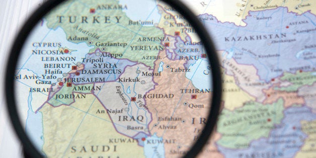 Syria and the Middle East on a map seen through a magnifying glass