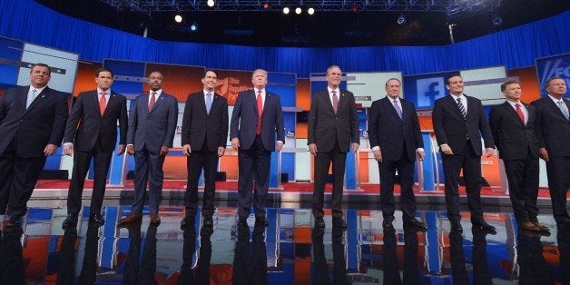 Republican presidential candidates arrive on stage for the Republican presidential debate on August 6, 2015 at the Quicken Loans Arena in Cleveland, Ohio. From left are: New Jersey Gov. Chris Christie; Florida Sen. Marco Rubio; retired neurosurgeon Ben Carson; Wisconsin Gov. Scott Walker; real estate magnate Donald Trump; former Florida Gov. Jeb Bush; former Arkansas Gov. Mike Huckabee; Texas Sen. Ted Cruz; Kentucky Sen. Rand Paul; and Ohio Gov. John Kasich. AFP PHOTO / MANDEL NGAN (Photo credit should read MANDEL NGAN/AFP/Getty Images)