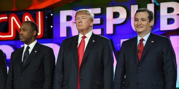 LAS VEGAS, NV - DECEMBER 15: Republican presidential candidates (L-R) Ben Carson, Donald Trump and Sen. Ted Cruz stand on st