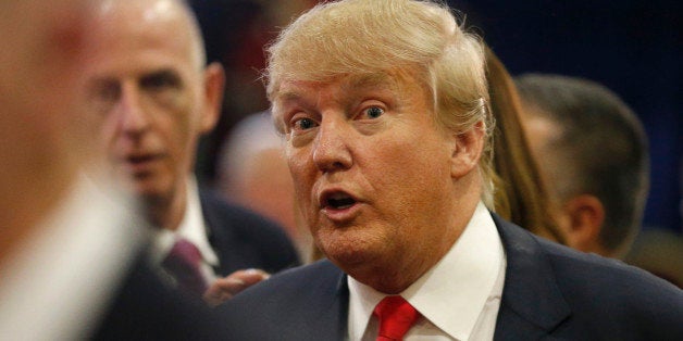 Donald Trump talks to reporters in the spin room following the CNN Republican presidential debate at the Venetian Hotel & Casino on Tuesday, Dec. 15, 2015, in Las Vegas. (AP Photo/Mark J. Terrill)