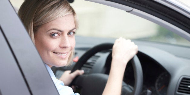 portrait of woman driving a car