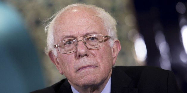 Senator Bernie Sanders, an independent from Vermont and 2016 Democratic presidential candidate, listens during an interfaith roundtable in Washington, D.C., U.S., on Wednesday, Dec. 16, 2015. Sanders said figures like Trump attempt to 'divide' Americans. 'A few months ago we're supposed to hate Mexicans and he thinks they're all criminals and rapists and now we're supposed to hate Muslims, and that kind of crap is not going to work in the United States of America,' he said. Photographer: Drew Angerer/Bloomberg via Getty Images