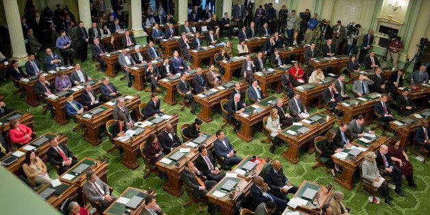 Legislators and guests listen to Gov. Jerry Brown give his inaugural address after he was sworn in to office for the fourth time on Monday, Jan. 5, 2015 at the State Capitol in Sacramento, Calif. (Hector Amezcua/Sacramento Bee/TNS via Getty Images)