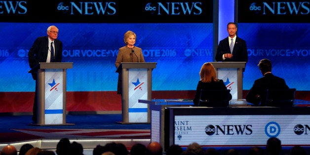 Bernie Sanders, left, Hillary Clinton, center, and Martin OâMalley take the stage for a Democratic presidential primary deb
