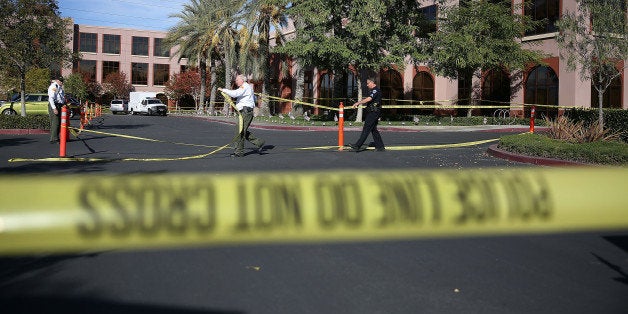 SAN BERNARDINO, CA - DECEMBER 07: Officials put up police tape in front of the builiding at the Inland Regional Center were 14 people were killed on December 7, 2015 in San Bernardino, California. FBI and other law enforcement officials continue to investigate the mass shooting at the Inland Regional Center in San Bernardino that left 14 people dead and another 21 injured on December 2nd. (Photo by Joe Raedle/Getty Images)