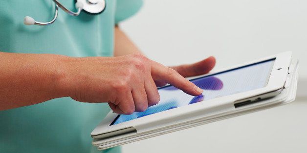 Healthcare professional using digital tablet