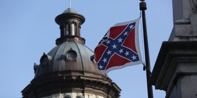 COLUMBIA, SC - JULY 09: The Confederate flag flies in front of the South Carolina statehouse for the last full day on July 9,