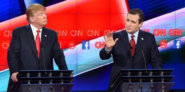 Republican presidential candidate businessman Donald Trump (L) looks on as Texas Sen. Ted Cruz speaks during the Republican Presidential Debate, hosted by CNN, at The Venetian Las Vegas on December 15, 2015 in Las Vegas, Nevada. AFP PHOTO / ROBYN BECK / AFP / ROBYN BECK (Photo credit should read ROBYN BECK/AFP/Getty Images)