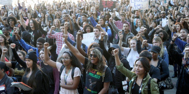 University California Los Angeles students stage a protest rally in a show of solidarity with protesters at the University of Missouri on Thursday, Nov. 12, 2015 in Los Angeles. Thousands of students across the U.S. took part in demonstrations at university campuses Thursday to show solidarity with protesters at the University of Missouri, and to shine a light on what they say are racial problems at their own schools. (AP Photo/Nick Ut)