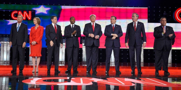 Republican presidential candidates, from left, John Kasich, Carly Fiorina, Marco Rubio, Ben Carson, Donald Trump, Ted Cruz, Jeb Bush, Chris Christie, and Rand Paul take the stage during the CNN Republican presidential debate at the Venetian Hotel & Casino on Tuesday, Dec. 15, 2015, in Las Vegas. (AP Photo/Mark J. Terrill)