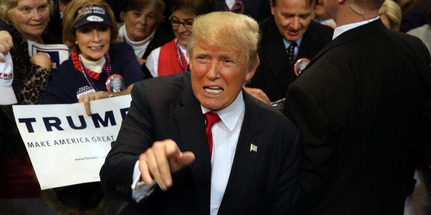 BILOXI, MS - JANUARY 02: Republican presidential frontrunner Donald Trump pauses with supporters after speaking at the Mississippi Coast Coliseum on January 2, 2016 in Biloxi, Mississippi. Trump, who has strong support from Southern voters, spoke to thousands in the small Mississippi city on the Gulf of Mexico. Trump continues to split the GOP establishment with his populist and controversial views on immigration, muslims and some of his recent comments on women. (Photo by Spencer Platt/Getty Images)