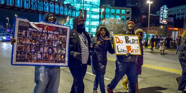 CLEVELAND, OH - DECEMBER 29: Protestores march on Huron Road on December 29, 2015 in Cleveland, Ohio. Demonstrators took to the street the day after a grand jury declined to indict Cleveland Police officer Timothy Loehmann for the fatal shooting of Tamir Rice on November 22, 2014. (Photo by Angelo Merendino/Getty Images)