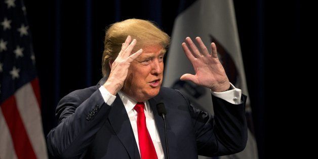 Republican presidential candidate Donald Trump gestures while speaking at a rally, Saturday, Jan. 9, 2016, in Ottumwa, Iowa. (AP Photo/Jae C. Hong)