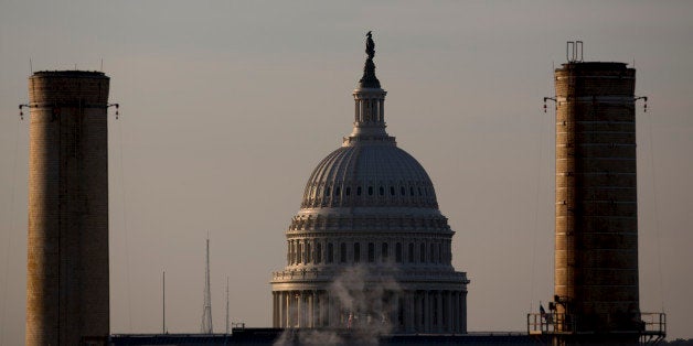 The U.S. Capitol Building stands past the natural gas and coal fueled Capitol Power Plant, which provides heating and cooling