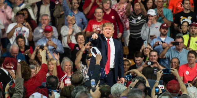 AIKEN, SC - DECEMBER 12: Republican presidential candidate Donald Trump points to the crowd at a town hall meeting December 12, 2015 in Aiken, South Carolina. The South Carolina Republican primary is scheduled for February 20, 2016. (Photo by Sean Rayford/Getty Images)