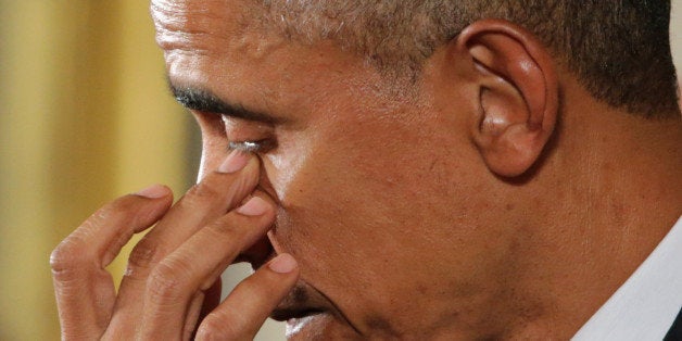 WASHINGTON, DC - JANUARY 05: U.S. President Barack Obama wipes away tears as talks about the victims of the 2012 Sandy Hook