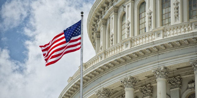 Washington DC Capitol dome detail with waving american flag