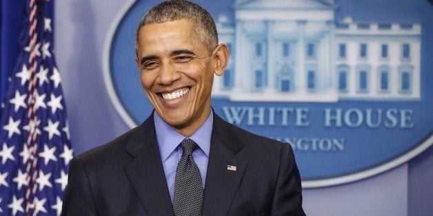 WASHINGTON, USA - DECEMBER 18: President Barack Obama smiles when members of the press shout of questions when he tries to end his end of the year news conference in the Brady Press Briefing Room at the White House in Washington, USA on December 18, 2015. (Photo by Samuel Corum/Anadolu Agency/Getty Images)