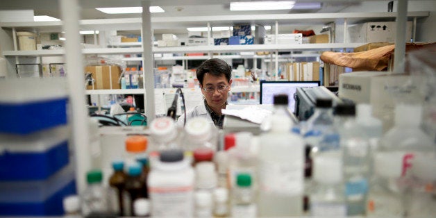 In this March 4, 2015 photo, research scientist Tony Huang works in a laboratory at Vertex Pharmaceuticals Inc. in San Diego.