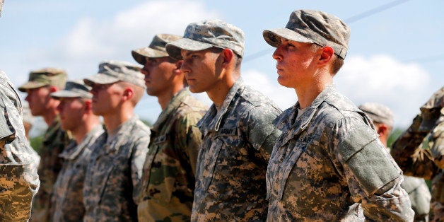 U.S. Army First Lt. Shaye Haver, right, stands in formation during an Army Ranger school graduation ceremony Friday, Aug. 21, 2015, at Fort Benning, Ga. Haver and Capt. Kristen Griest became the first female soldiers to complete the Army's rigorous school, putting a spotlight on the debate over women in combat. (AP Photo/John Bazemore)