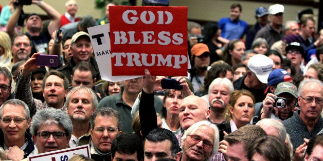 People listen to Republican presidential candidate Donald Trump at a rally Sunday, Jan. 10, 2016, in Reno, Nev. (AP Photo/Lance Iversen)