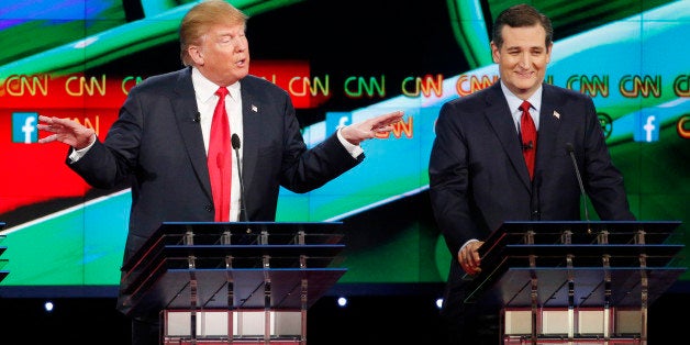 Donald Trump, left, speaks as Ted Cruz looks on during the CNN Republican presidential debate at the Venetian Hotel & Casino on Tuesday, Dec. 15, 2015, in Las Vegas. (AP Photo/John Locher)