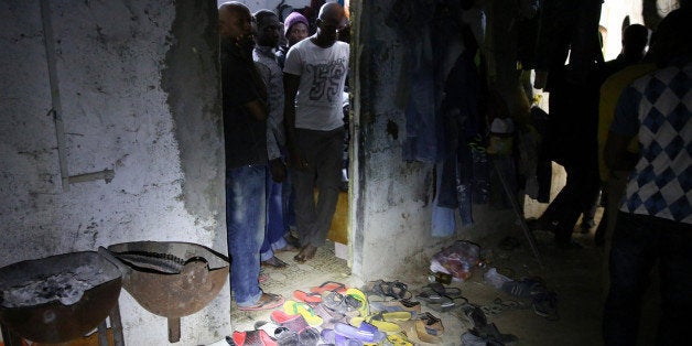 African migrants are crowded into a room during a raid by immigration police on the outskirts of Tripoli, Libya, early Tuesday, Oct. 13, 2015. Smugglers have exploited Libya's internal turmoil, with two rival governments battling for control, to ship thousands of desperate migrants across the Mediterranean. (AP Photo/Mohamed Ben Khalifa)