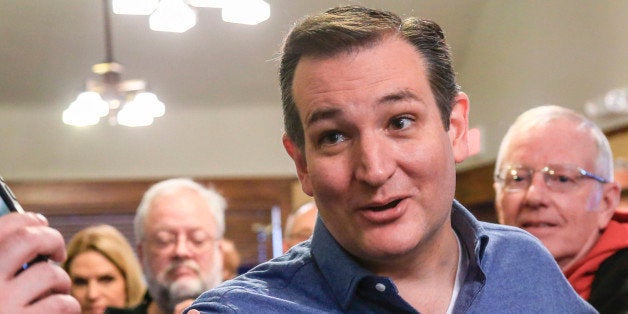 Republican Presidential candidate, Sen. Ted Cruz, R-Texas talks to a reporter while standing with supporter Court Oviatt of L