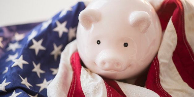 Close up of piggy bank and American flag