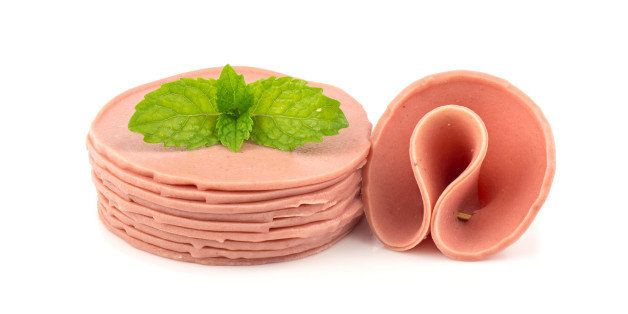 Raw fresh baloney sausage - food on white background