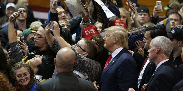 CEDAR FALLS, IA - JANUARY 12: People greet Republican presidential candidate Donald Trump during a campaign event at the University of Northern Iowa on January 12, 2016 in Cedar Falls, Iowa. Trump continues his quest to become the Republican presidential nominee. (Photo by Joe Raedle/Getty Images)