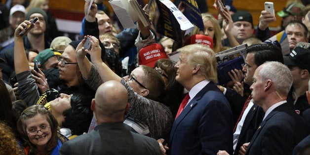 CEDAR FALLS, IA - JANUARY 12: People greet Republican presidential candidate Donald Trump during a campaign event at the Uni