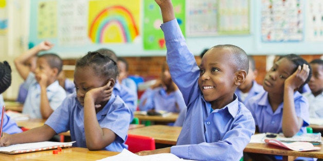 Student raising hand in class