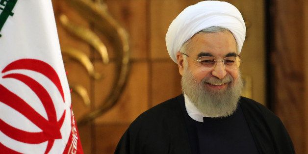 Iranian President Hassan Rouhani speaks during a press conference on January 17, 2016 in the capital Tehran after international sanctions on Iran were lifted. Rouhani said that sceptics who said a nuclear deal with world powers would not bring benefits to Iran were all proven wrong. / AFP / ATTA KENARE (Photo credit should read ATTA KENARE/AFP/Getty Images)