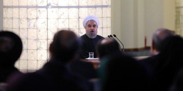 TEHRAN, IRAN - JANUARY 17: Iranian President Hassan Rouhani (C) gives a speech during a press conference in Tehran, Iran on J