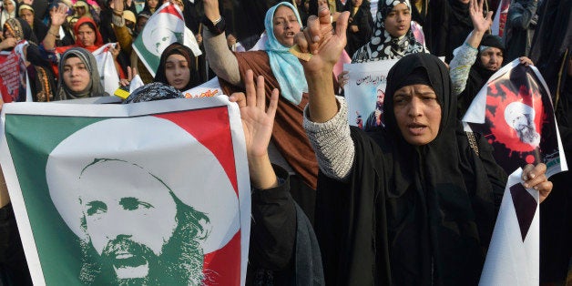 Pakistani Shiite Muslim women shout slogans during a protest in Lahore on January 3, 2016, against the execution of prominent
