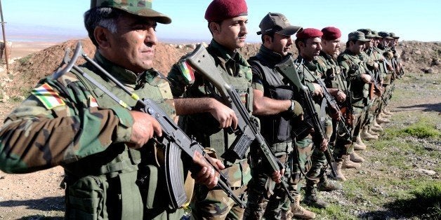 MOSUL, IRAQ - DECEMBER 10: Female Syrian Peshmerga fighters are being trained to fight against Daesh and Assad forces at a c