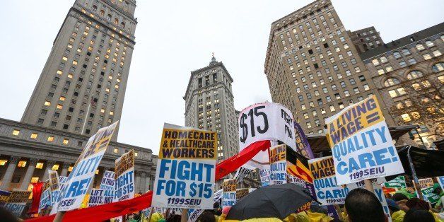 NEW YORK, NY - NOVEMBER 10: Low wage workers and supporters protest for a $15 an hour minimum wage on November 10, 2015 at Foley Square in New York, United States. The protesters are demanding action from state legislators and presidential candidates to raise the minimum wage to $15 USD an hour. (Photo by Cem Ozdel/Anadolu Agency/Getty Images)