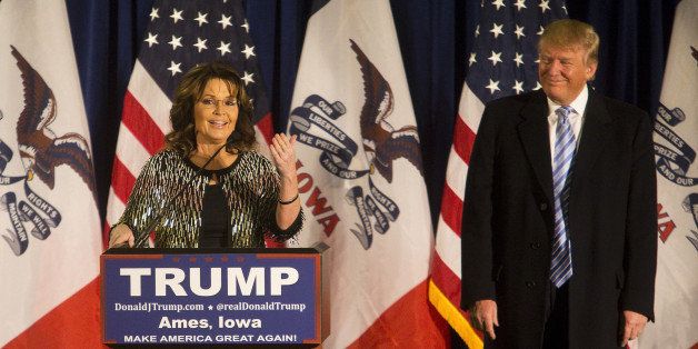 Sarah Palin, former governor of Alaska, left, speaks as Donald Trump, president and chief executive of Trump Organization Inc. and 2016 Republican presidential candidate, listens during a campaign rally at the Hansen Agricultural Student Learning Center at Iowa State University in Ames, Iowa, U.S., on Tuesday, Jan. 19, 2016. Trump's campaign to win the Iowa caucuses in less than two weeks received a boost from a Tea Party favorite, Sarah Palin. Photographer: Cassi Alexandra/Bloomberg via Getty Images 