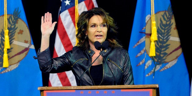 Former Republican vice presidential candidate Sarah Palin speaks to a crowd as she introduces Republican presidential candida