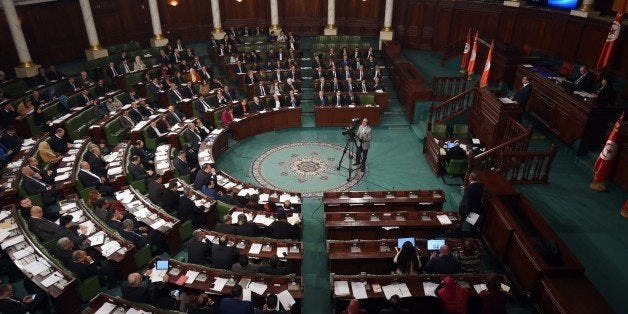 Tunisian MPs take part in a session at the assembly of the representatives of the people (ARP) on January 11, 2016 in Tunis before a confidence vote to approve the new government. Tunisian Prime Minister Habib Essid announced a major cabinet reshuffle on January 6, 2016 as his government grapples with a growing jihadist threat and a feeble economy. / AFP / FETHI BELAID (Photo credit should read FETHI BELAID/AFP/Getty Images)