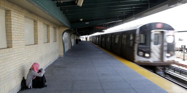 A Muslim girl waits on a subway platform for her train to arrive, Oct. 8, 2015 in the Brooklyn borough of New York. (AP Photo/Mark Lennihan)