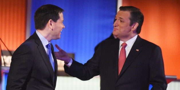 Republican presidential candidate, Sen. Marco Rubio, R-Fla., speaks with Republican presidential candidate, Sen. Ted Cruz, R-Texas, during a break at the Fox Business Network Republican presidential debate at the North Charleston Coliseum, Thursday, Jan. 14, 2016, in North Charleston, S.C. (AP Photo/Rainier Ehrhardt)