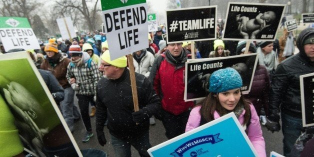 Anti-abortion demonstrators march to the US Supreme Court in Washington, DC, 0n January 22, 2016 as the country marks the 43r